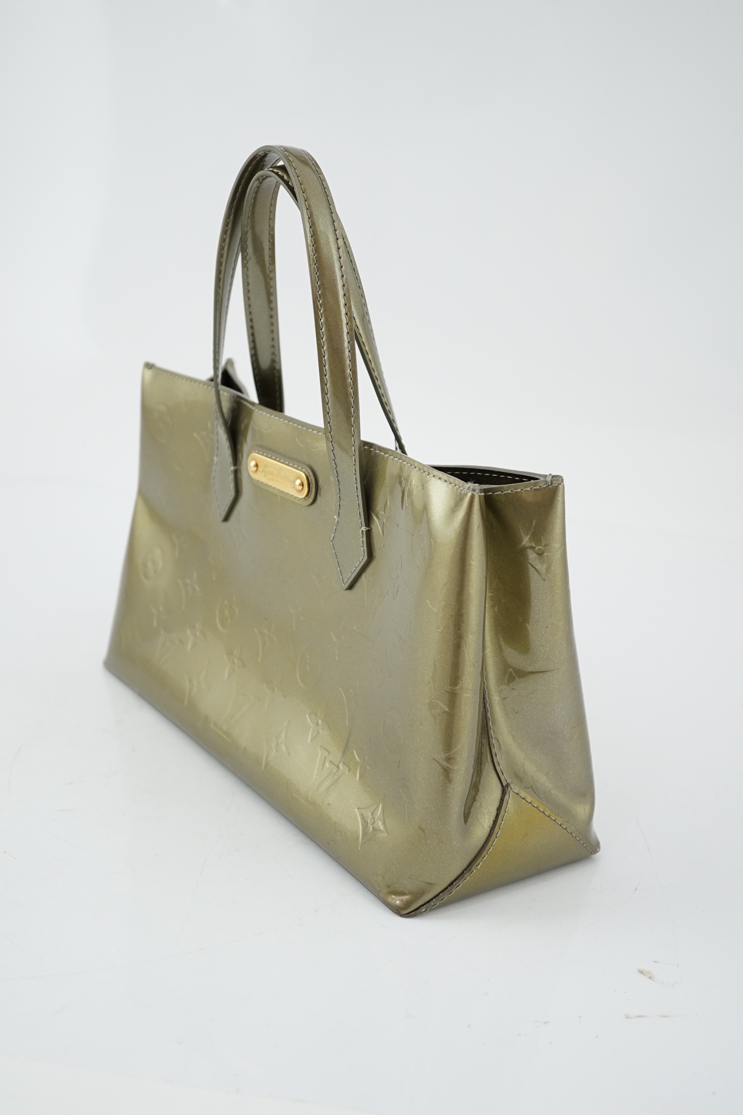 A Louis Vuitton gold metallic monogram tote bag, height 18cm, height to handle 29cm, width 31cm, depth 11.5cm